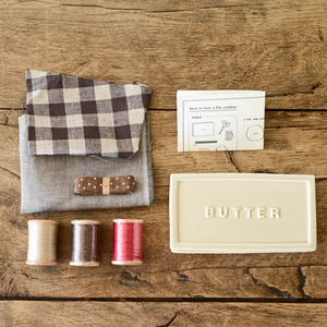 Sewing kit in butter case